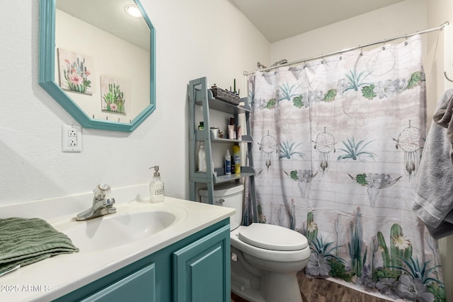 full bathroom with a shower with shower curtain, vanity, toilet, and wood finished floors