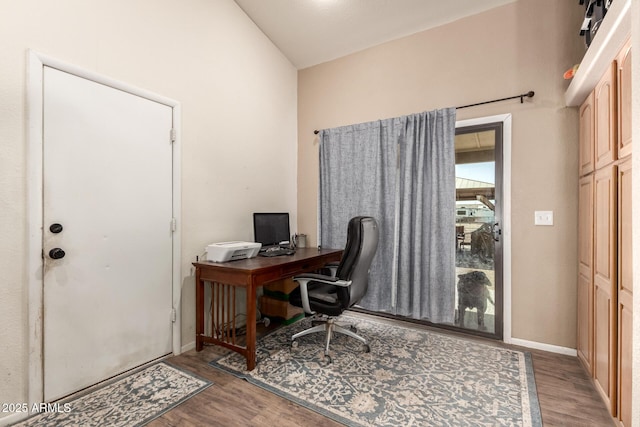 home office featuring wood finished floors and baseboards