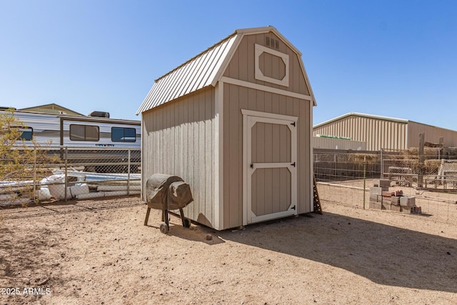 view of outdoor structure with an outdoor structure and fence