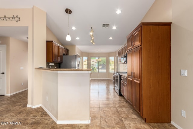 kitchen featuring kitchen peninsula, light tile patterned floors, vaulted ceiling, pendant lighting, and stainless steel appliances