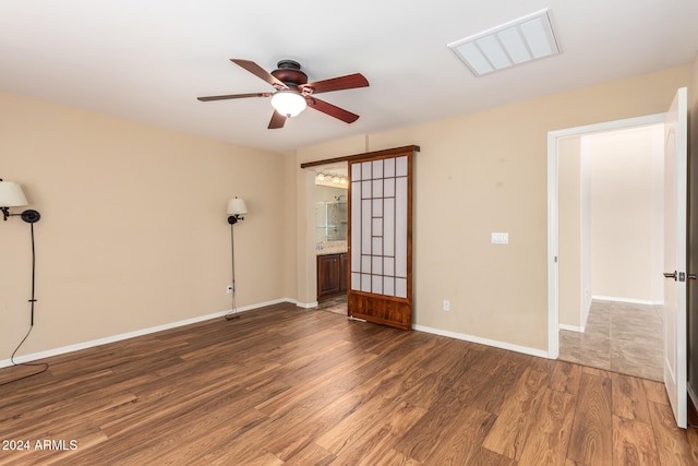 spare room featuring ceiling fan and hardwood / wood-style flooring