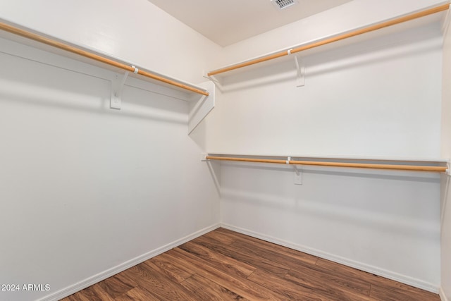 walk in closet featuring hardwood / wood-style flooring