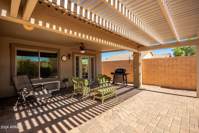 view of patio / terrace featuring a pergola and ceiling fan