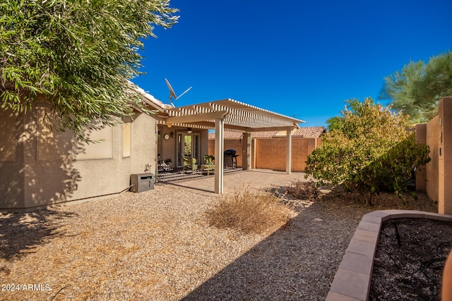 view of yard with a patio and a pergola