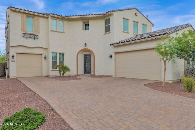 mediterranean / spanish-style home featuring a garage