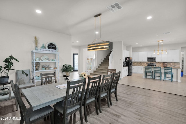 dining area featuring light wood-type flooring