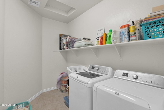 clothes washing area featuring independent washer and dryer