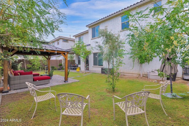 view of yard featuring an outdoor living space, a gazebo, and a patio