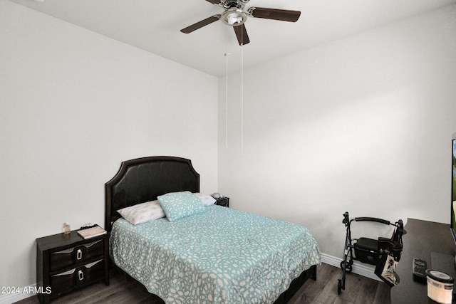 bedroom featuring ceiling fan and dark hardwood / wood-style flooring