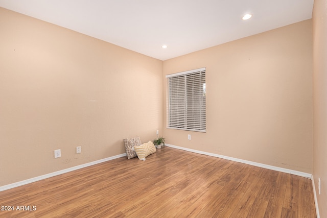 unfurnished room with light wood-type flooring