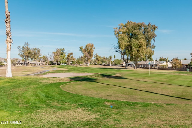 view of property's community featuring a lawn