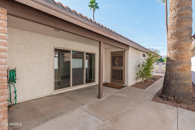 doorway to property with a patio area