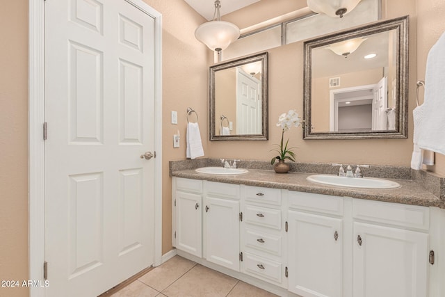 bathroom with tile patterned flooring and vanity