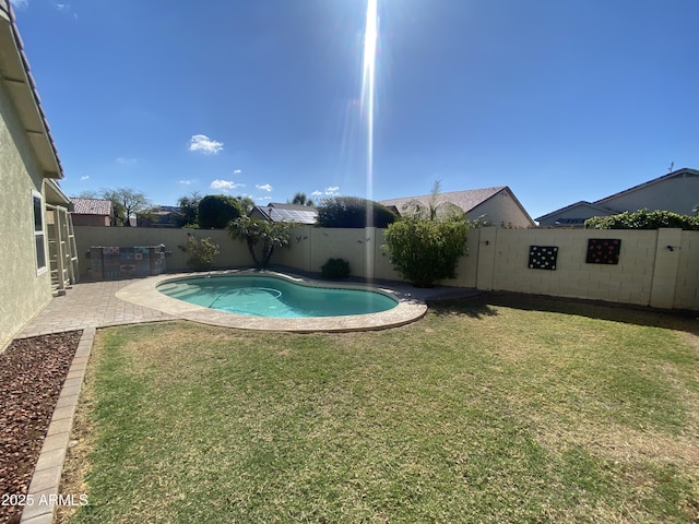 10817 W Wilshire Dr, Avondale, AZ 85392 - view of swimming pool with a fenced backyard, a fenced in pool, a patio, and a yard
