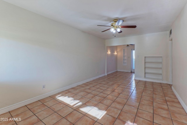 602 E San Juan Ave, Phoenix, AZ 85012 - tiled spare room featuring ceiling fan and built in shelves