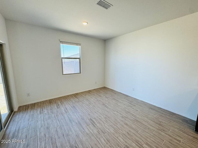 47267 W Mellen Ln, Maricopa, AZ 85139 - spare room featuring wood finished floors and baseboards