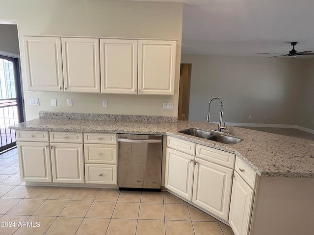 kitchen with sink, white cabinetry, light tile patterned floors, ceiling fan, and stainless steel dishwasher