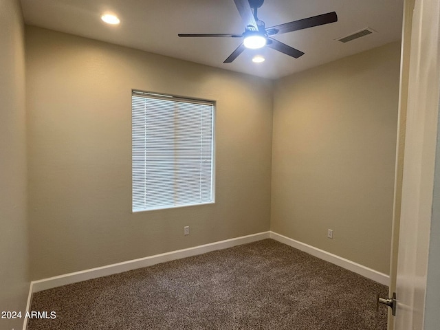 spare room with carpet and ceiling fan