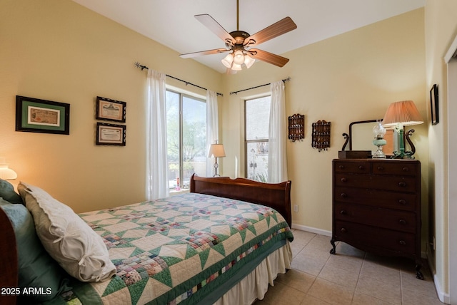 bedroom featuring light tile patterned flooring, baseboards, access to exterior, and ceiling fan