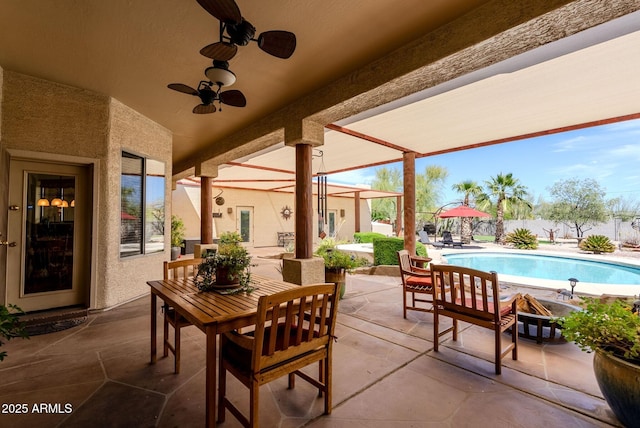 view of patio featuring a fenced in pool and outdoor dining area