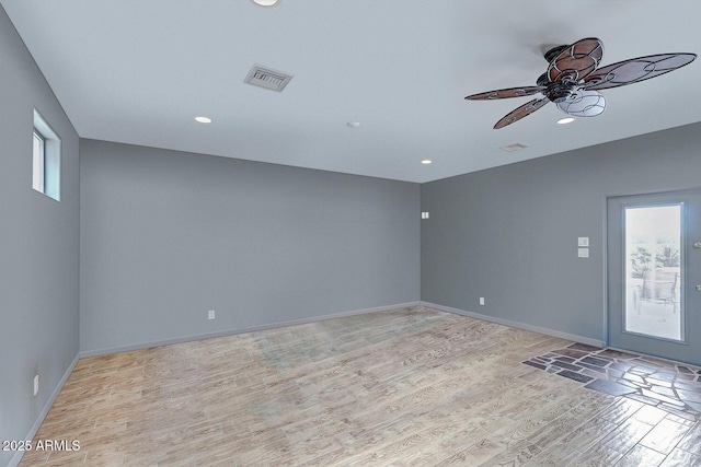 empty room featuring recessed lighting, ceiling fan, visible vents, and light wood-style flooring