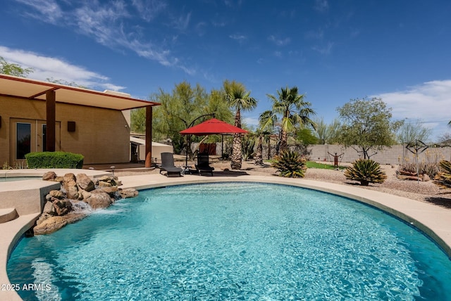 view of pool featuring fence, a fenced in pool, and a patio area