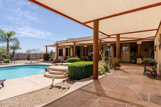 view of swimming pool with a patio, a fenced in pool, and a fenced backyard
