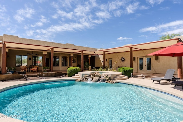 outdoor pool featuring french doors, an in ground hot tub, a patio area, and ceiling fan