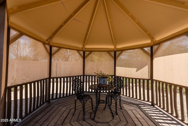 wooden deck featuring fence and a gazebo