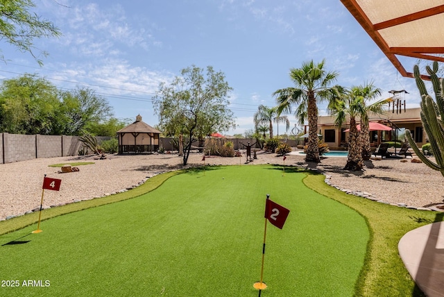 surrounding community with a gazebo, a fenced backyard, and a swimming pool