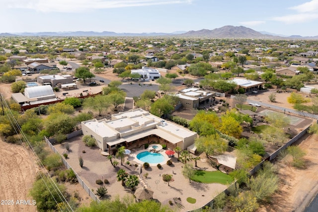 birds eye view of property with a mountain view and a residential view