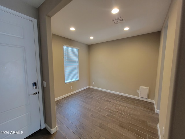 unfurnished room with hardwood / wood-style floors