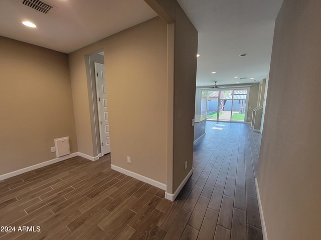 hallway with dark wood-type flooring