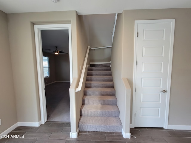 stairs with ceiling fan