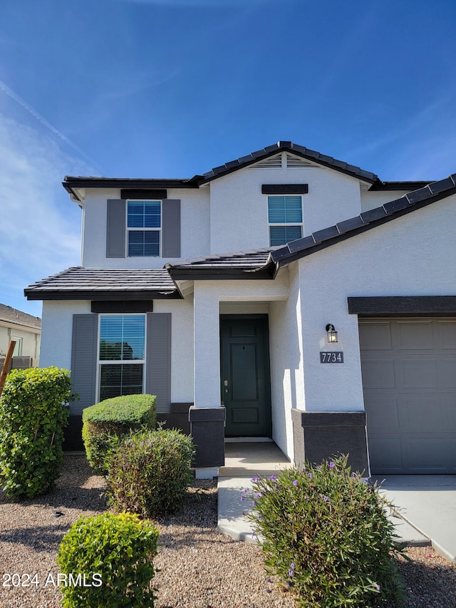 front of property with a garage