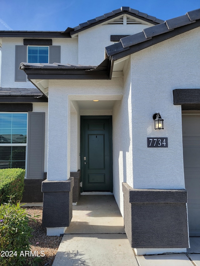 property entrance featuring a garage