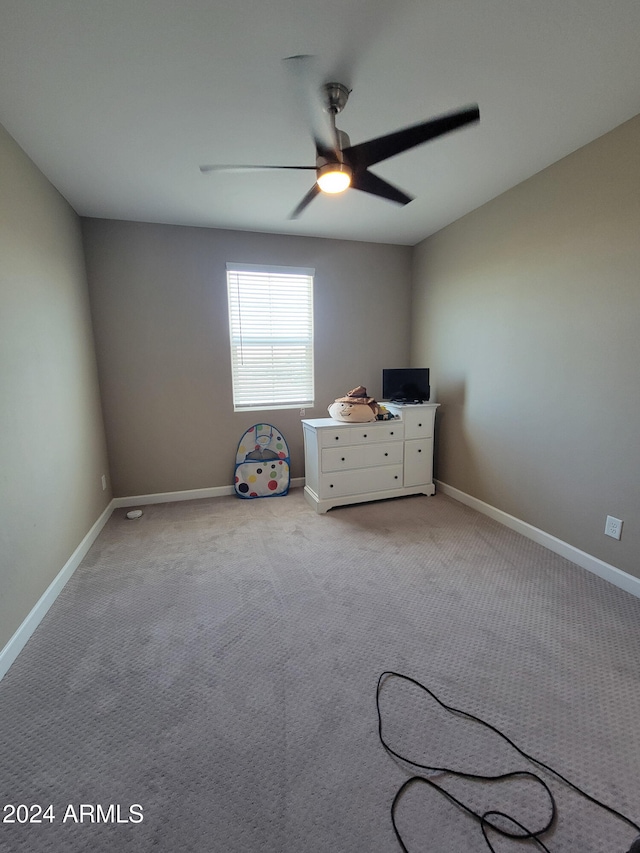 interior space with ceiling fan