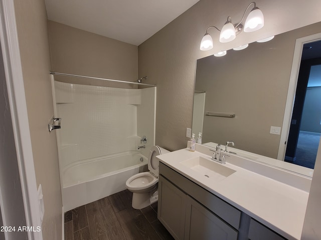 full bathroom with hardwood / wood-style flooring, vanity, toilet, and washtub / shower combination