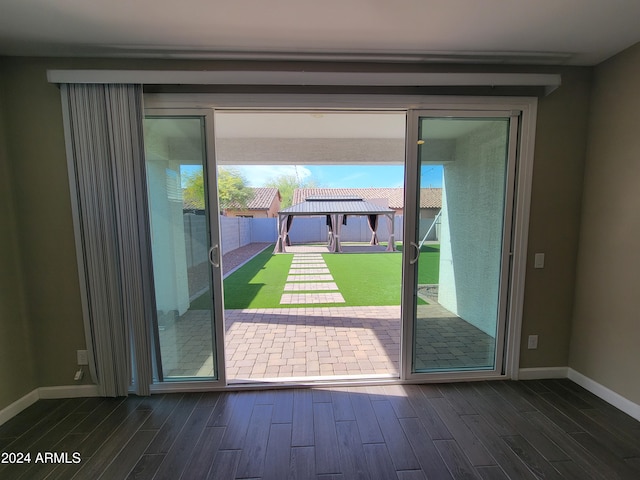 entryway with dark hardwood / wood-style flooring