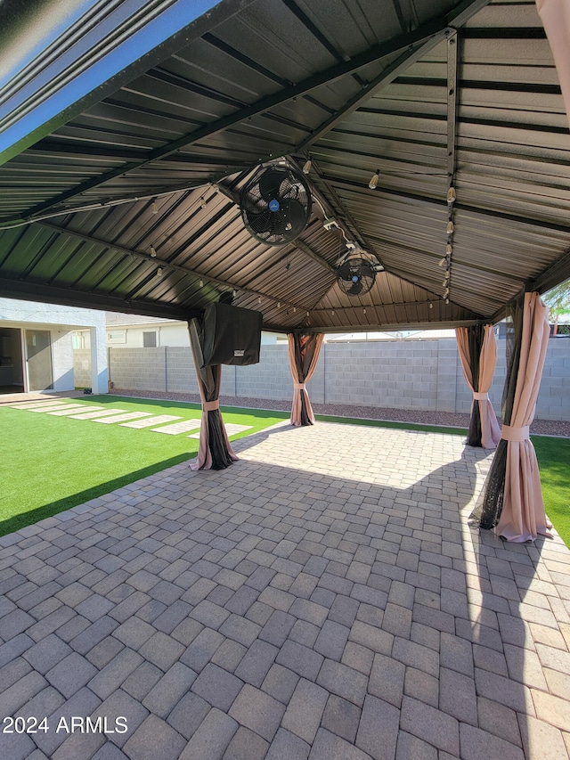 view of patio / terrace featuring a gazebo and ceiling fan