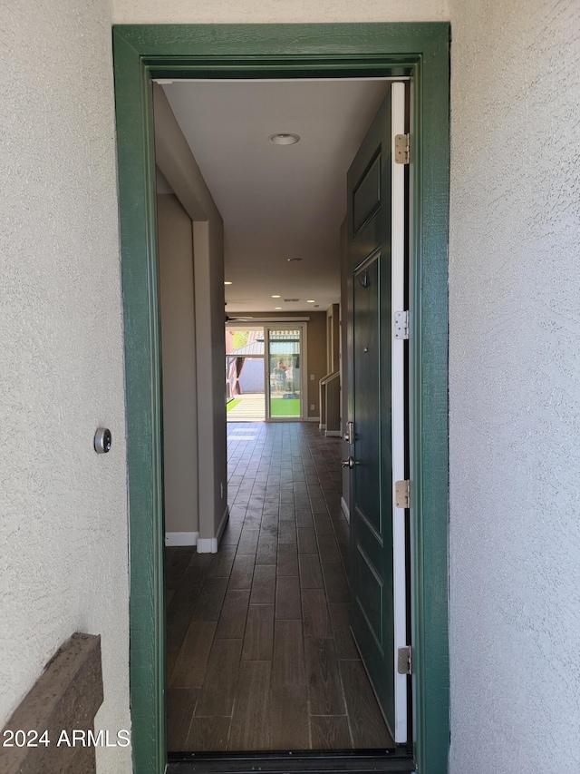 corridor featuring dark wood-type flooring