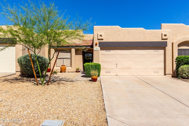 10863 N 117th Pl, Scottsdale, AZ 85259 - adobe home featuring driveway, stucco siding, and a garage
