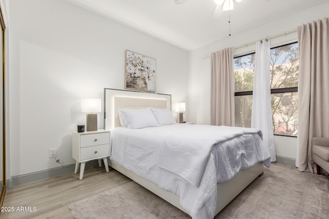 10863 N 117th Pl, Scottsdale, AZ 85259 - bedroom featuring wood finished floors and ceiling fan