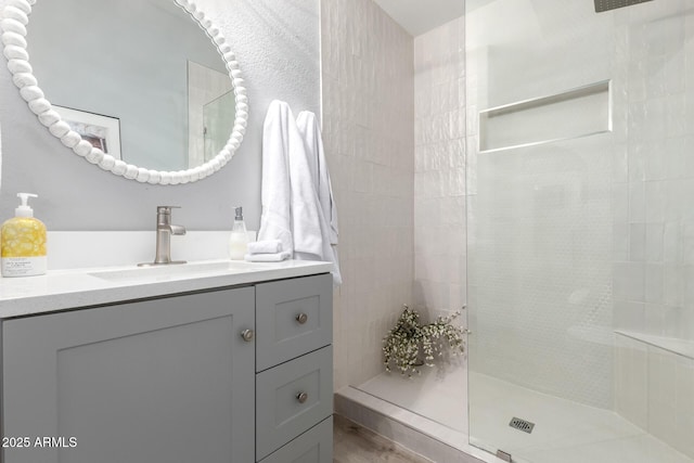10863 N 117th Pl, Scottsdale, AZ 85259 - bathroom with walk in shower, vanity, and wood finished floors