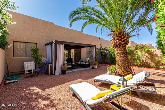 10863 N 117th Pl, Scottsdale, AZ 85259 - view of patio with an outdoor hangout area and fence