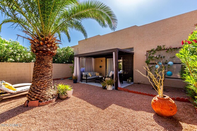 10863 N 117th Pl, Scottsdale, AZ 85259 - rear view of house with an outdoor living space, a patio area, stucco siding, and fence