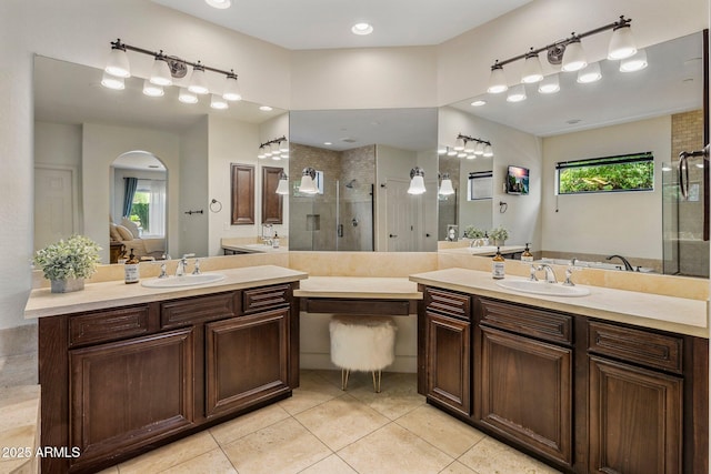 9904 E S Bend Dr, Scottsdale, AZ 85255 - bathroom featuring a shower stall, tile patterned floors, and two vanities