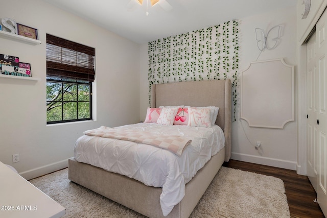 9904 E S Bend Dr, Scottsdale, AZ 85255 - bedroom with baseboards, wood finished floors, a closet, and ceiling fan