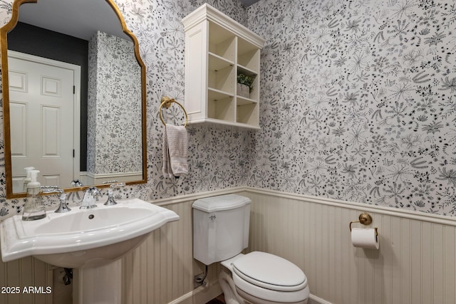 9904 E S Bend Dr, Scottsdale, AZ 85255 - half bath with wallpapered walls, toilet, and wainscoting