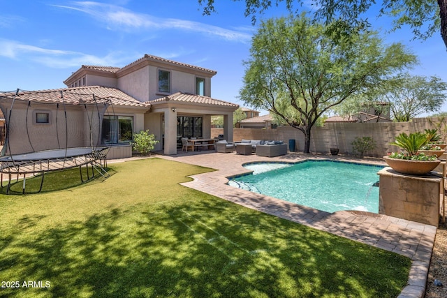 9904 E S Bend Dr, Scottsdale, AZ 85255 - back of house featuring an outdoor hangout area, a trampoline, stucco siding, a patio, and a tile roof